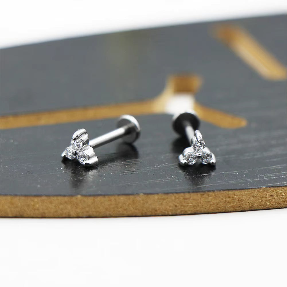 Modernes Zirkon‑Piercing mit klarer Form und Stil So ist Leben