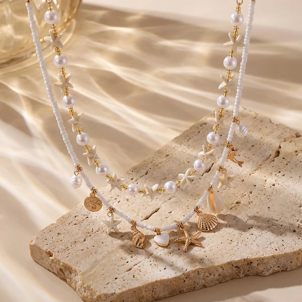 Boho Mehrschichtige Muschel-Seestern-Anhänger-Halskette für Frauen Handgefertigte Perlen-Imitationsperlen-Choker Strandparty-Schmuck Geschenk So ist Leben
