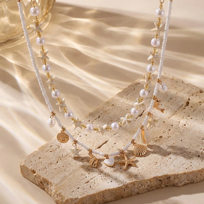 Boho Mehrschichtige Muschel-Seestern-Anhänger-Halskette für Frauen Handgefertigte Perlen-Imitationsperlen-Choker Strandparty-Schmuck Geschenk So ist Leben