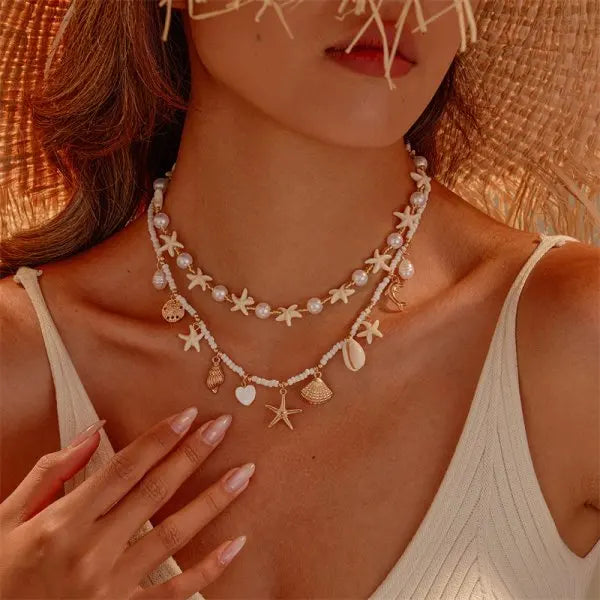 Boho Mehrschichtige Muschel-Seestern-Anhänger-Halskette für Frauen Handgefertigte Perlen-Imitationsperlen-Choker Strandparty-Schmuck Geschenk So ist Leben