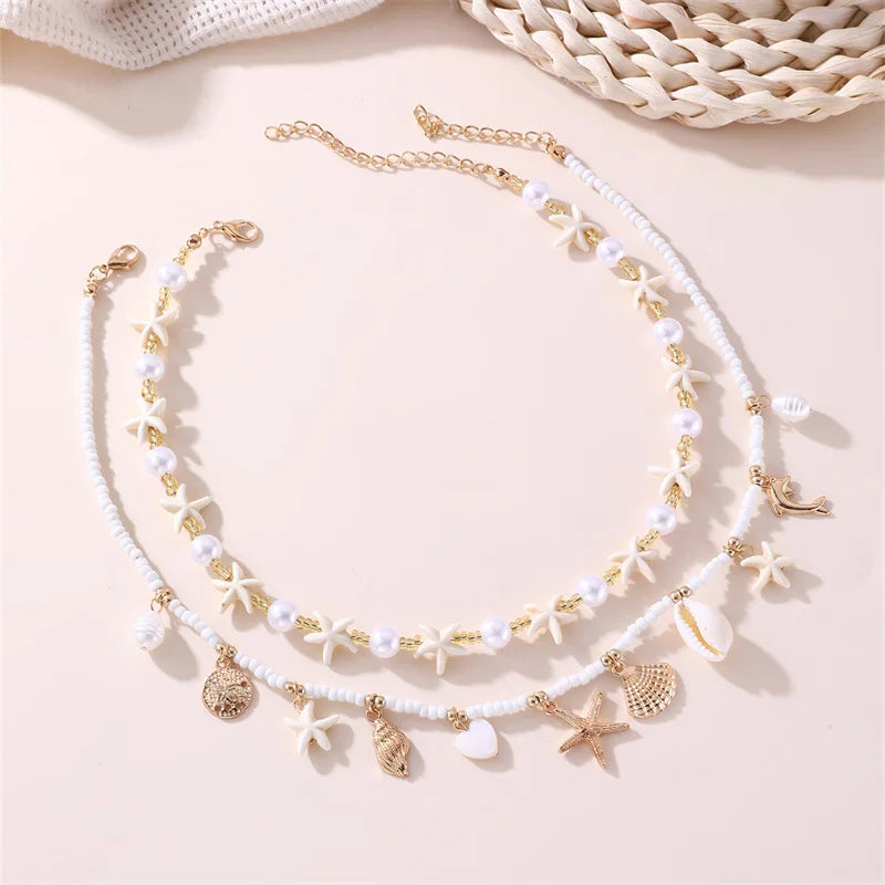Boho Mehrschichtige Muschel-Seestern-Anhänger-Halskette für Frauen Handgefertigte Perlen-Imitationsperlen-Choker Strandparty-Schmuck Geschenk So ist Leben
