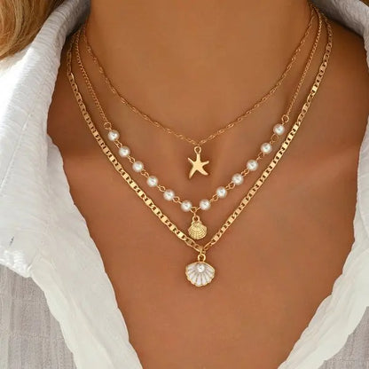 Boho Mehrschichtige Muschel-Seestern-Anhänger-Halskette für Frauen Handgefertigte Perlen-Imitationsperlen-Choker Strandparty-Schmuck Geschenk So ist Leben