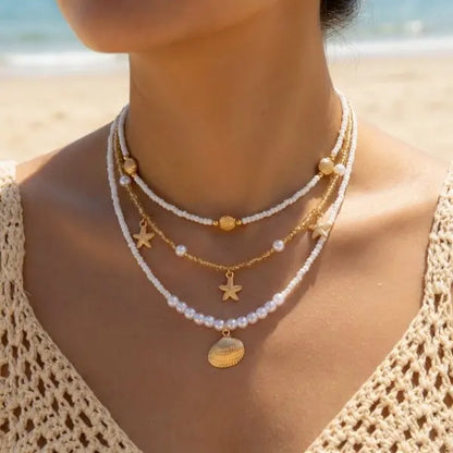 Boho Mehrschichtige Muschel-Seestern-Anhänger-Halskette für Frauen Handgefertigte Perlen-Imitationsperlen-Choker Strandparty-Schmuck Geschenk So ist Leben
